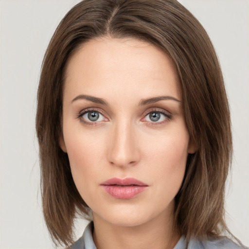 Neutral white young-adult female with medium  brown hair and grey eyes