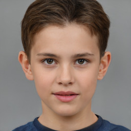 Joyful white child male with short  brown hair and brown eyes