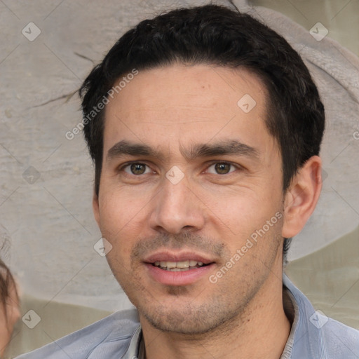 Joyful white adult male with short  black hair and brown eyes