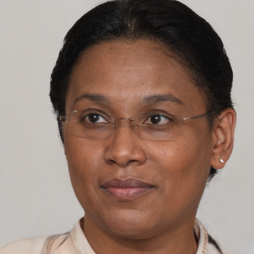 Joyful latino adult female with short  brown hair and brown eyes