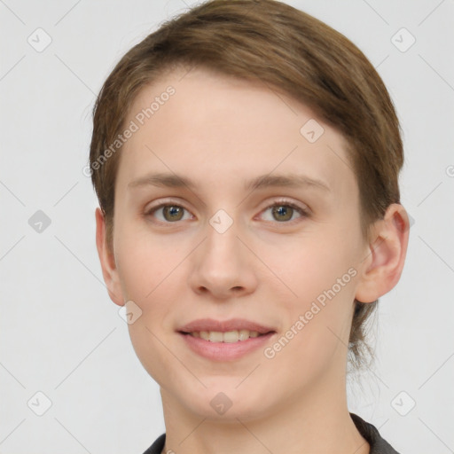 Joyful white young-adult female with short  brown hair and grey eyes