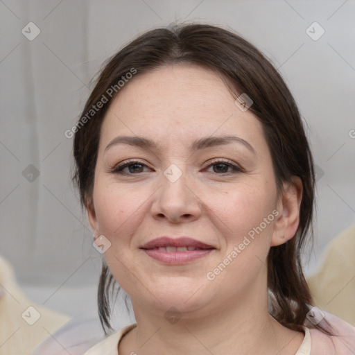 Joyful white adult female with medium  brown hair and brown eyes