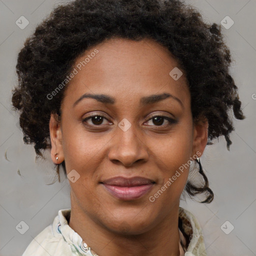 Joyful black adult female with short  brown hair and brown eyes