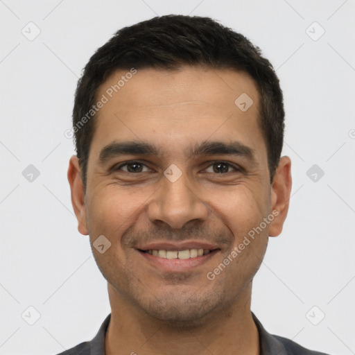 Joyful white young-adult male with short  black hair and brown eyes