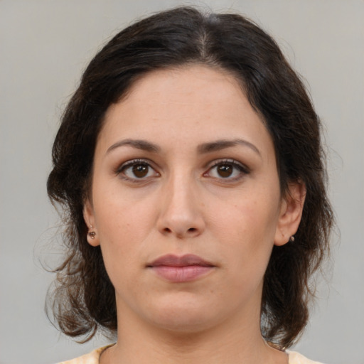 Neutral white young-adult female with medium  brown hair and brown eyes