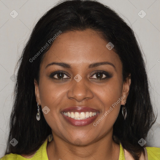 Joyful black young-adult female with long  brown hair and brown eyes