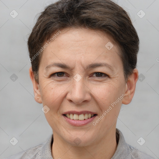 Joyful white adult female with short  brown hair and brown eyes