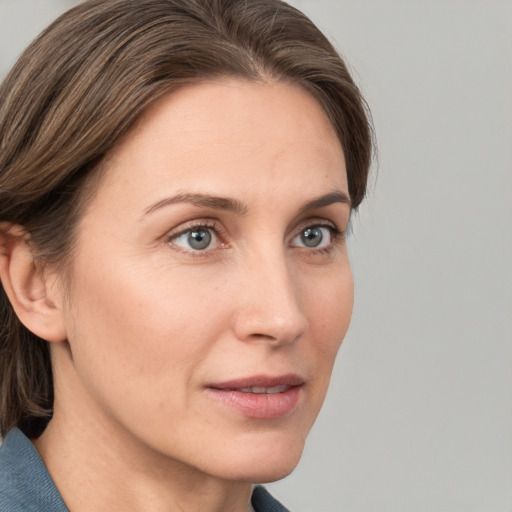 Neutral white young-adult female with medium  brown hair and grey eyes