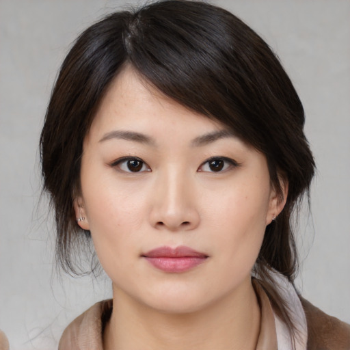 Neutral asian young-adult female with medium  brown hair and brown eyes