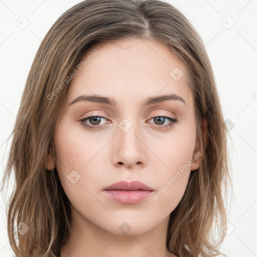 Neutral white young-adult female with long  brown hair and brown eyes