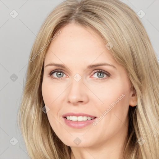 Joyful white young-adult female with long  brown hair and blue eyes