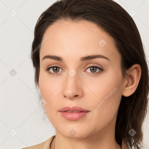 Neutral white young-adult female with long  brown hair and brown eyes