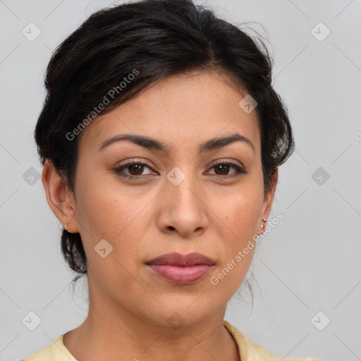 Joyful latino young-adult female with medium  brown hair and brown eyes