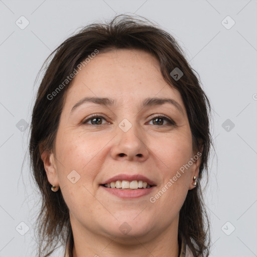 Joyful white adult female with medium  brown hair and brown eyes