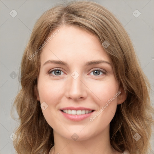 Joyful white young-adult female with medium  brown hair and green eyes