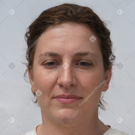 Joyful white adult female with short  brown hair and brown eyes