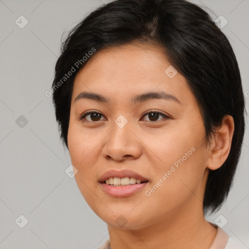 Joyful asian young-adult female with medium  brown hair and brown eyes