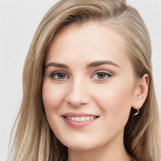 Joyful white young-adult female with long  brown hair and grey eyes