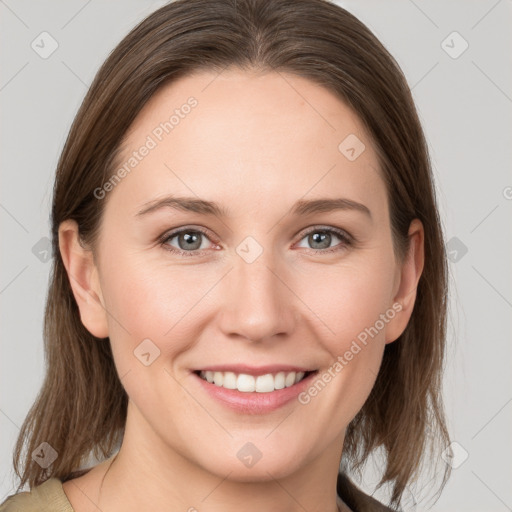 Joyful white young-adult female with medium  brown hair and grey eyes