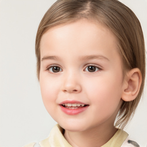 Joyful white child female with medium  brown hair and brown eyes