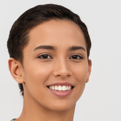 Joyful latino young-adult female with short  brown hair and brown eyes