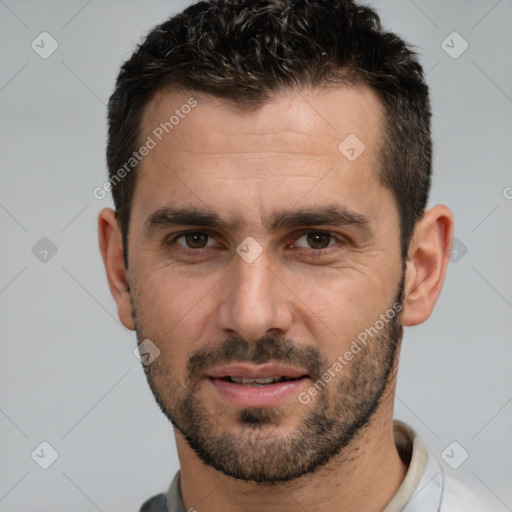 Joyful white young-adult male with short  black hair and brown eyes