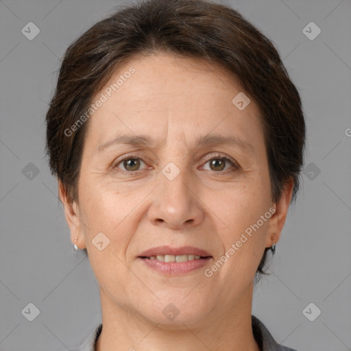 Joyful white adult female with short  brown hair and brown eyes