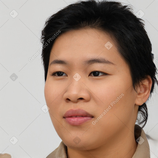 Joyful asian young-adult female with medium  black hair and brown eyes