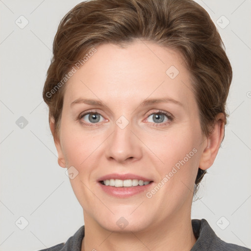 Joyful white adult female with short  brown hair and grey eyes