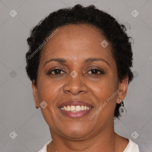 Joyful black adult female with short  brown hair and brown eyes