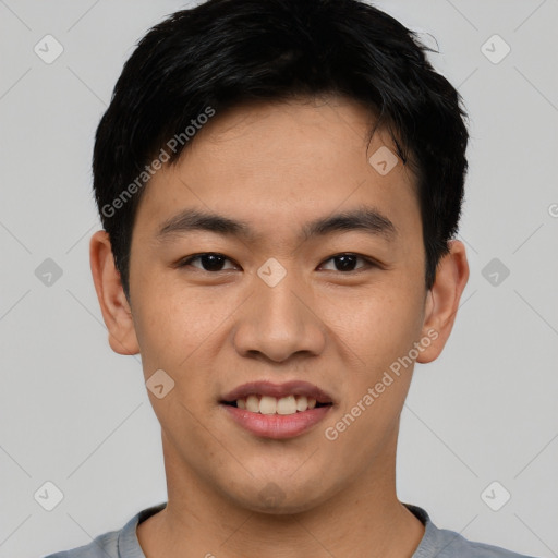 Joyful asian young-adult male with short  brown hair and brown eyes