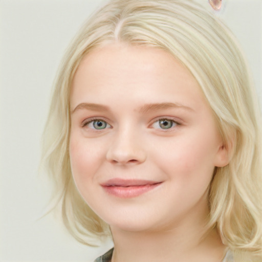 Joyful white child female with medium  blond hair and blue eyes