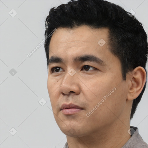 Neutral asian young-adult male with short  black hair and brown eyes