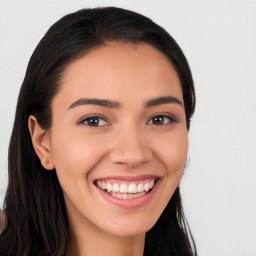 Joyful white young-adult female with long  black hair and brown eyes