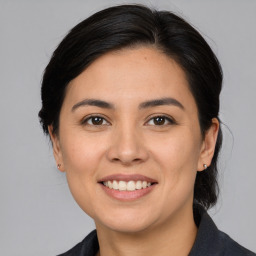 Joyful white young-adult female with medium  brown hair and brown eyes