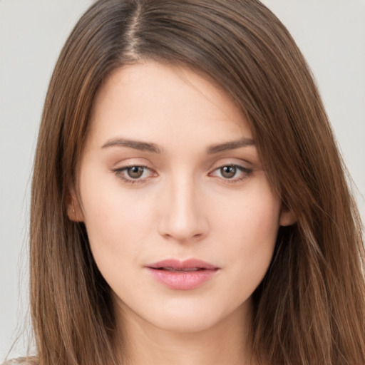 Neutral white young-adult female with long  brown hair and brown eyes