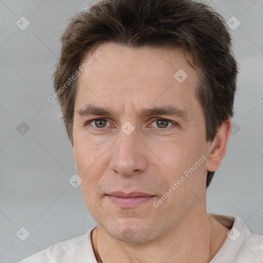 Joyful white adult male with short  brown hair and brown eyes