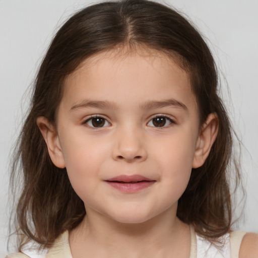 Joyful white child female with medium  brown hair and brown eyes