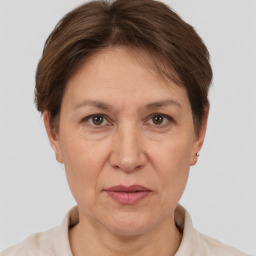 Joyful white adult female with short  brown hair and brown eyes