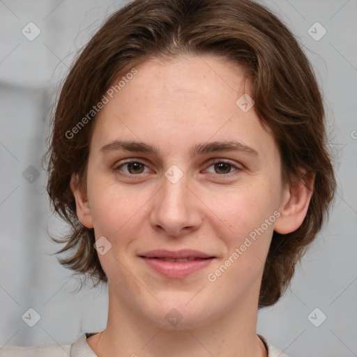 Joyful white young-adult female with medium  brown hair and green eyes