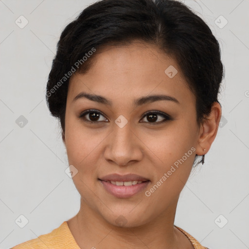 Joyful latino young-adult female with short  brown hair and brown eyes