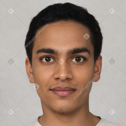 Joyful latino young-adult male with short  black hair and brown eyes