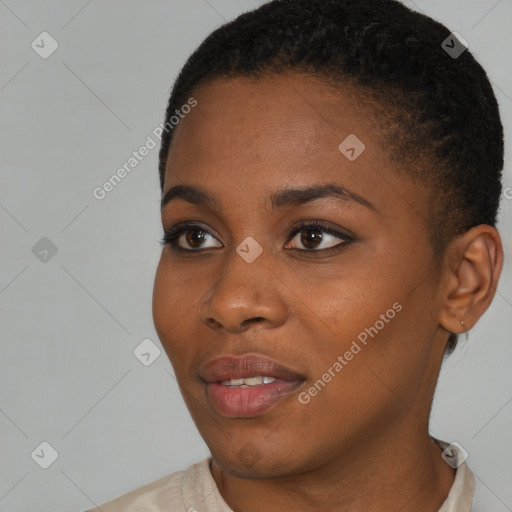 Joyful black young-adult female with short  brown hair and brown eyes