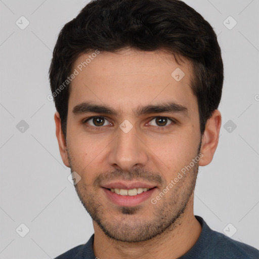 Joyful white young-adult male with short  black hair and brown eyes