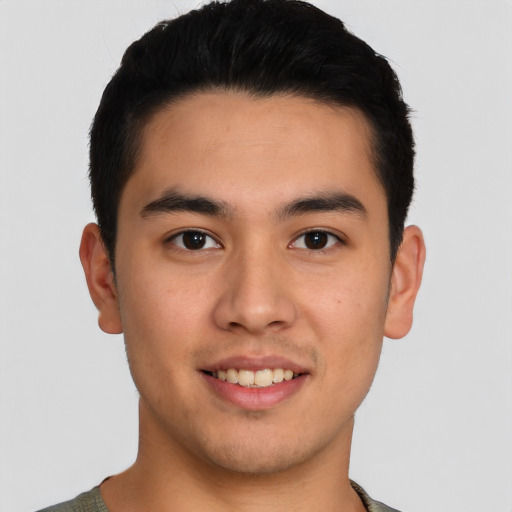 Joyful asian young-adult male with short  brown hair and brown eyes