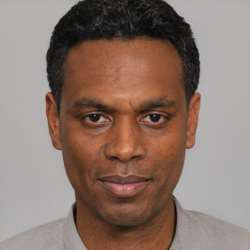 Neutral black adult male with short  black hair and brown eyes