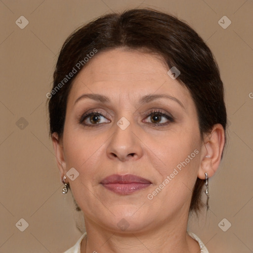 Joyful white adult female with medium  brown hair and brown eyes