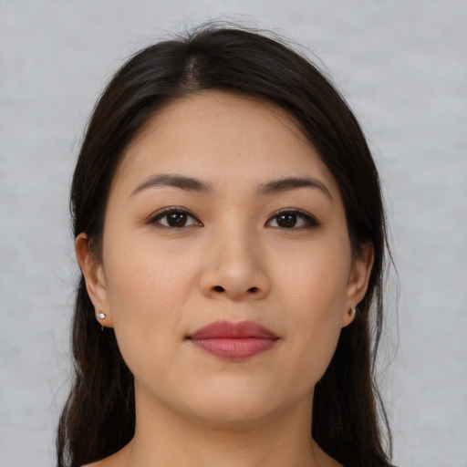 Joyful asian young-adult female with medium  brown hair and brown eyes