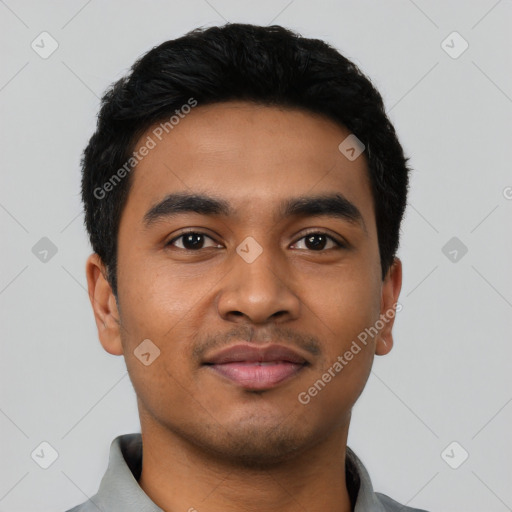 Joyful latino young-adult male with short  black hair and brown eyes