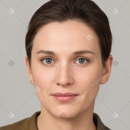 Joyful white young-adult female with short  brown hair and grey eyes